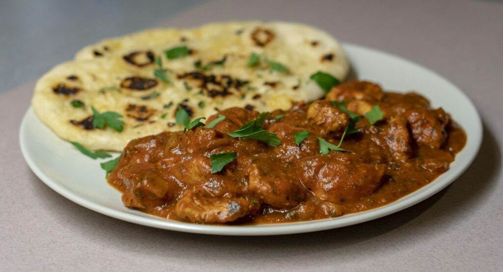 Chicken curry served with naan