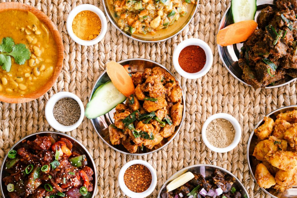 A table spread of Indian curries, breads and spices (illustrative photo)