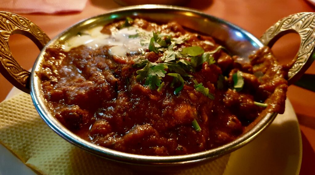 Lamb curry in a copper kadai