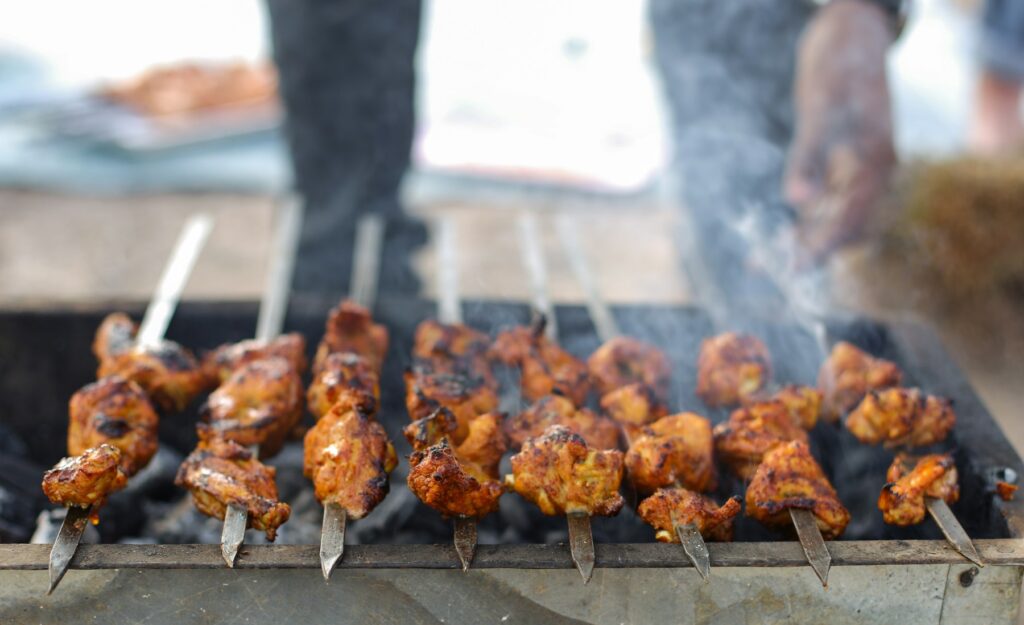 Chicken tikka skewers on the grill